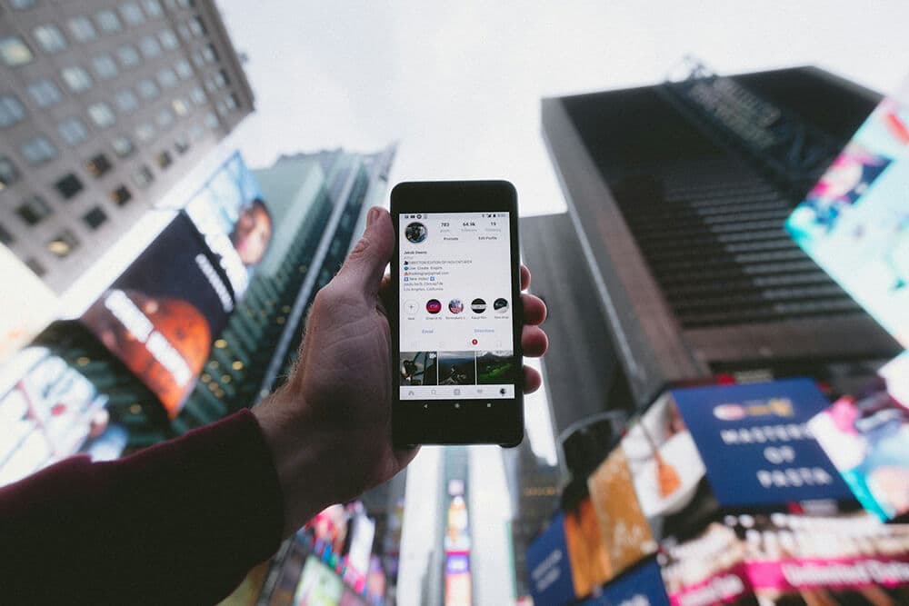 person holding turned on smartphone