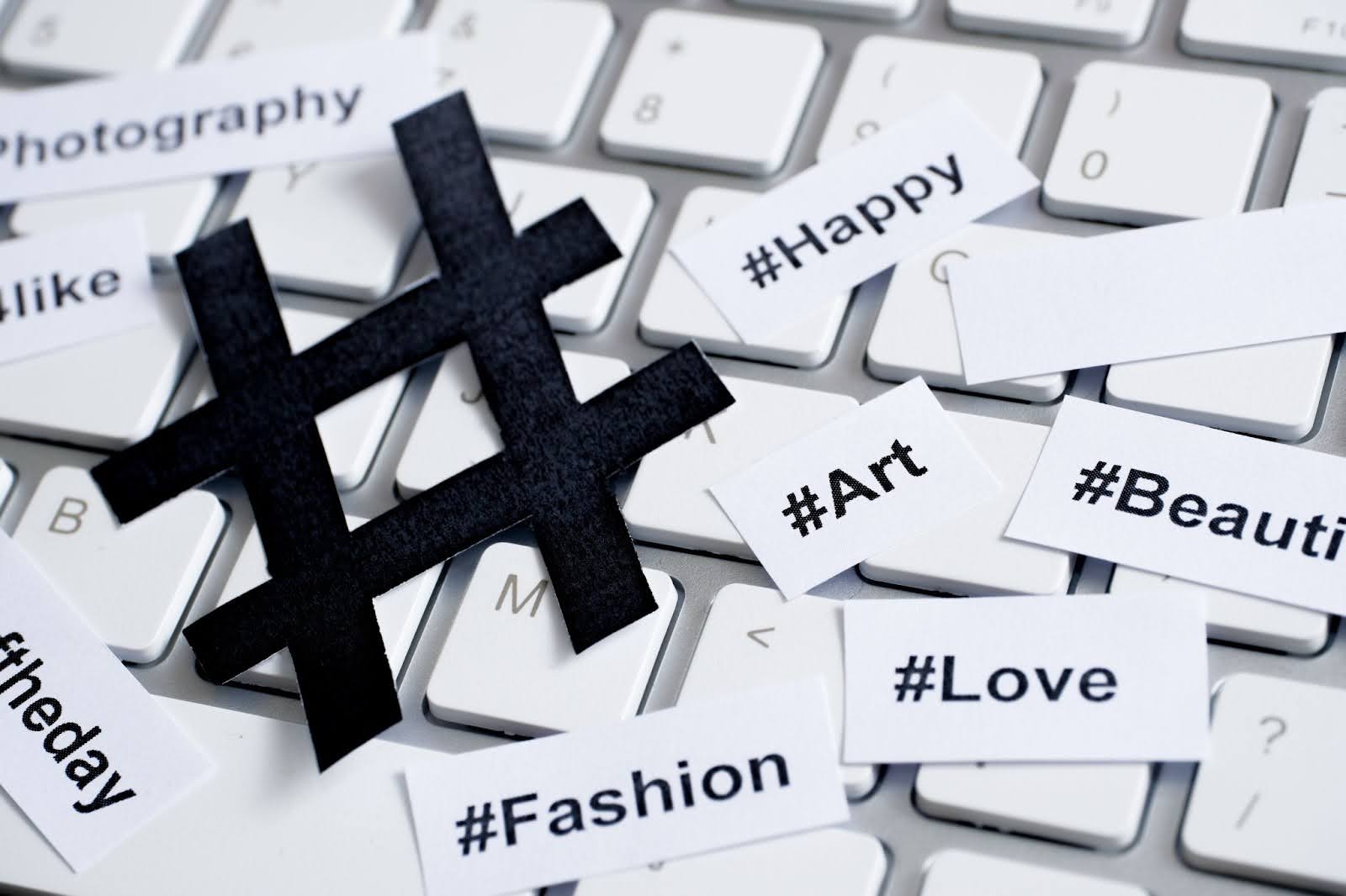 Popular hashtags printed with sign on paper and on the keyboard
